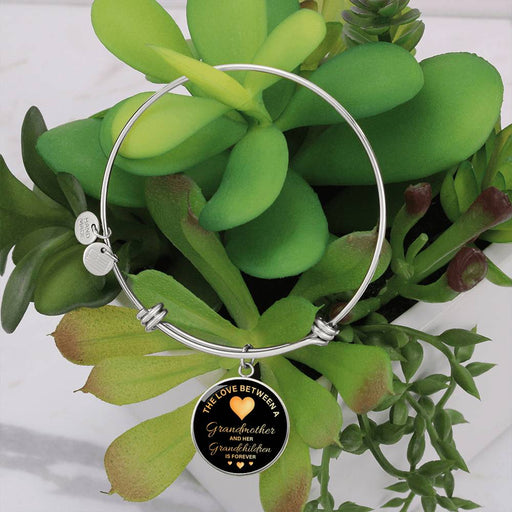 Surprise your granddaughter with this Luxury Bangle Bracelet.  You can engrave onto the back of the pendant your granddaughter's name, wedding date, anniversary, or anything else you want to remember. It makes a truly unique piece that she'll cherish for years!