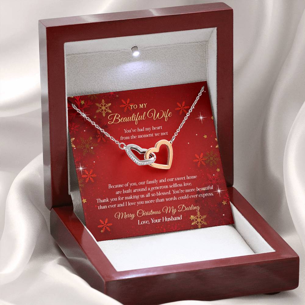 Our Interlocking Hearts Necklace is made of high-quality polished steel. Two hearts embellished with Cubic Zirconia stones interlocked together as a symbol of never-ending love and made with high-quality polished surgical steel. The cable chain measures 18 inches with a 4-inch extension and fastens with a lobster clasp.