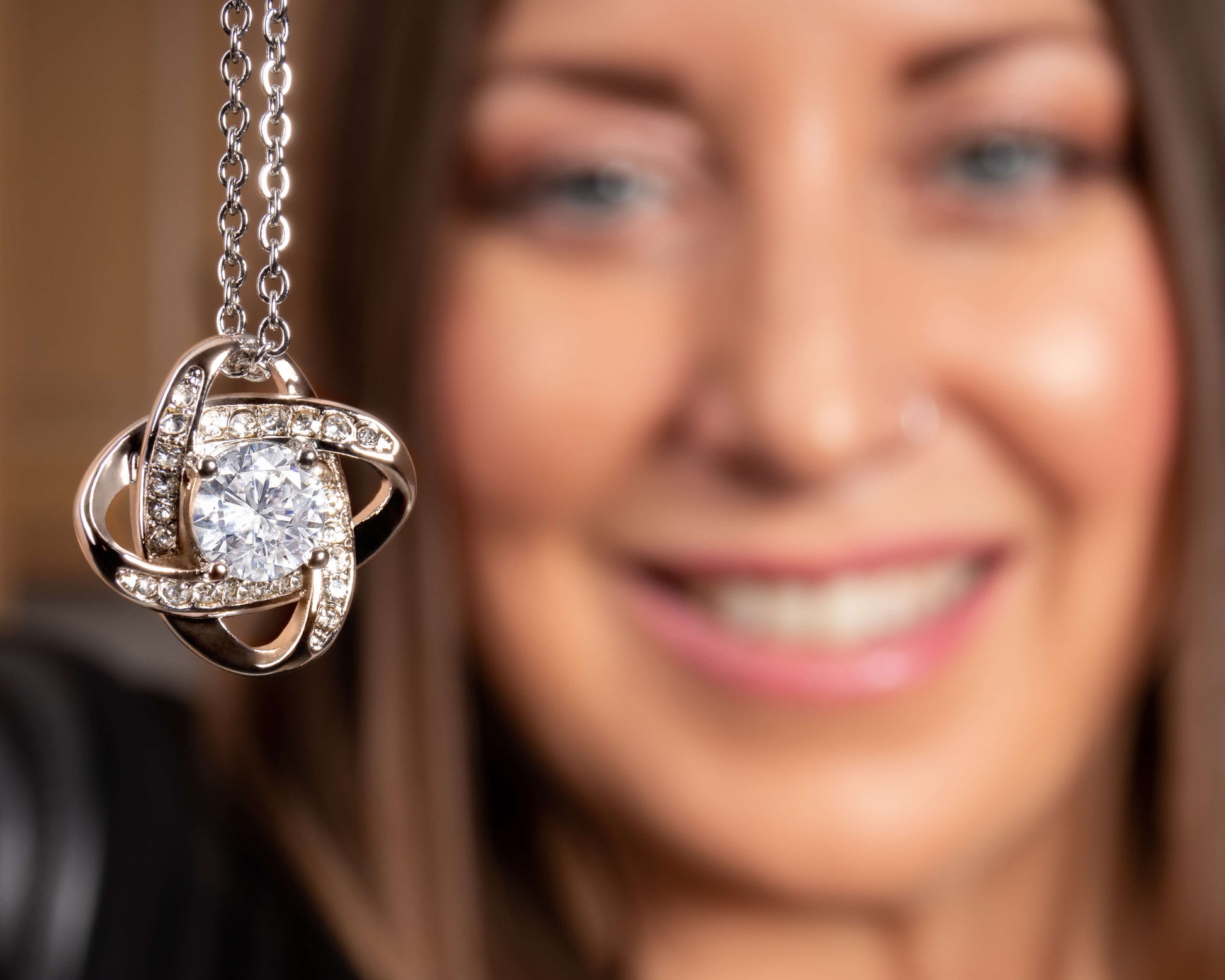 The Love Knot Necklace represents an unbreakable bond between two souls. Surprise your loved one with this gorgeous gift today! The beautiful Love Knot is crafted with brilliant 14k white gold over stainless steel and swings from an adjustable cable chain fastened securely with a lobster clasp. 