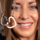 Two hearts necklace interlocked together as a symbol of never-ending love.  The pendant makes a perfect for your wife or girlfriend! Rekindle that romantic spark in your relationship with this great gift.